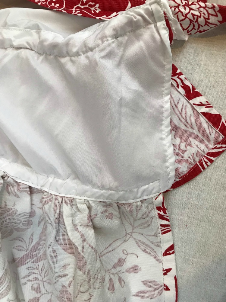 Nostalgic Farmhouse Christmas Aprons & Towels | blowingawayoutwest.com - Tutorial for Farmhouse Christmas (or any occasion) ruffled aprons and fun Christmas towels #holidaybaking #farmhouseapron #Christmasapron #christmastowels #12daysofChristmas