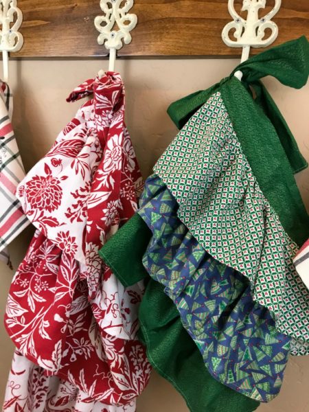 Nostalgic Farmhouse Christmas Aprons & Towels | blowingawayoutwest.com - Tutorial for Farmhouse Christmas (or any occasion) ruffled aprons and fun Christmas towels #holidaybaking #farmhouseapron #Christmasapron #christmastowels #12daysofChristmas