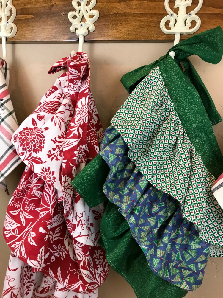Nostalgic Farmhouse Christmas Aprons & Towels | blowingawayoutwest.com - Tutorial for Farmhouse Christmas (or any occasion) ruffled aprons and fun Christmas towels #holidaybaking #farmhouseapron #Christmasapron #christmastowels #12daysofChristmas