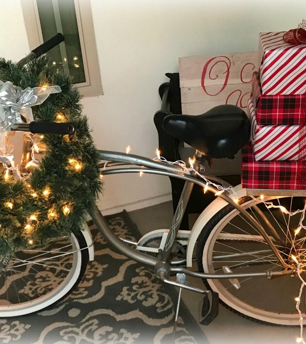 Journey to Christmas Porch Decor | blowingawayoutwest.com - Bicycle inspired Christmas porch decor. #christmasporchdecor #christmasporchdecorations #christmasbicycle #christmasporch #holidayporch #christmasdisplay #12daysofchristmas