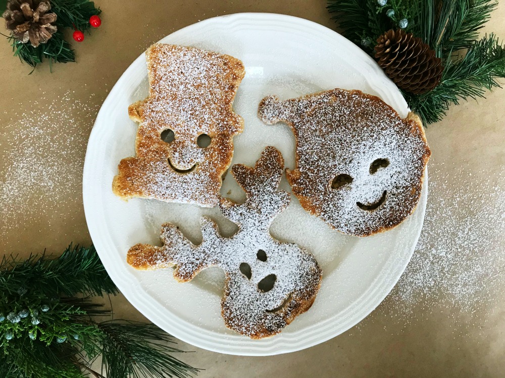 Ho Ho Holiday Pancakes | blowingawayoutwest.com - Molded Christmas Pancakes, perfect for a holiday brunch #christmaspancakes #holidaypancakes #christmaspancakesforkids #christmasmorningbreakfast #12daysofChristmas