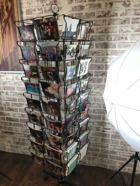 Style School: The Postcard Photograph Display| blowingawayoutwest.com - How to decoratively display all those loose photos using a postcard rack. #photodisplay #framedphotos #photodisplayideas #photodisplayideasdiy #photodisplayideascreative #uniquephotodisplayideas