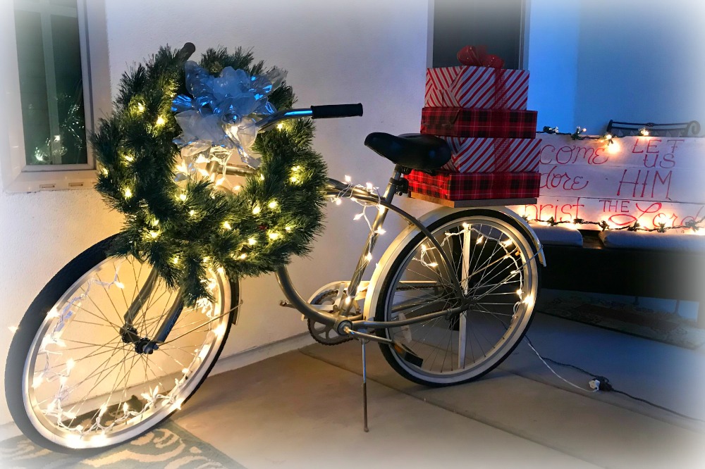 Journey to Christmas Porch Decor | blowingawayoutwest.com - Bicycle inspired Christmas porch decor. #christmasporchdecor #christmasporchdecorations #christmasbicycle #christmasporch #holidayporch #christmasdisplay #12daysofchristmas 