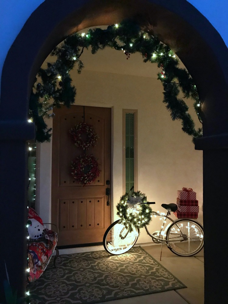 Journey to Christmas Porch Decor | blowingawayoutwest.com - Bicycle inspired Christmas porch decor. #christmasporchdecor #christmasporchdecorations #christmasbicycle #christmasporch #holidayporch #christmasdisplay #12daysofchristmas 
