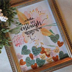 You're Enough Genuine Compliments Gift Idea | blowingawayoutwest.com - Tell her how much she means with framed gift hearts filled with compliments #giftsforher #diygiftsforher #giftsforwomen #youreenough #diychristmasgifts #diychristmasgiftsforher #giftsforgirls